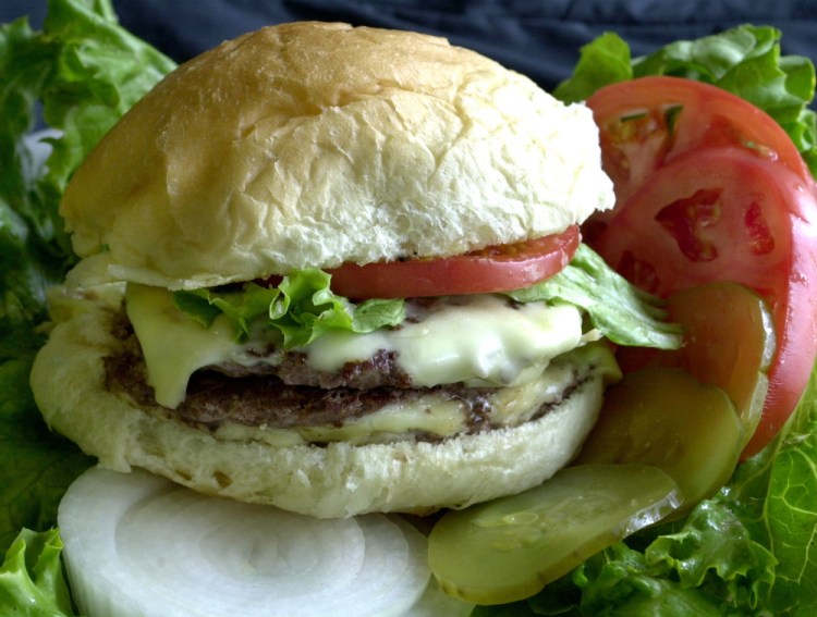New studies of the diets of thousands of people in the United States, Canada and the United Kingdom found that if they reduce the amount of meat they eat, like the cheeseburger pictured here, it will help to lower greenhouse gas emissions.