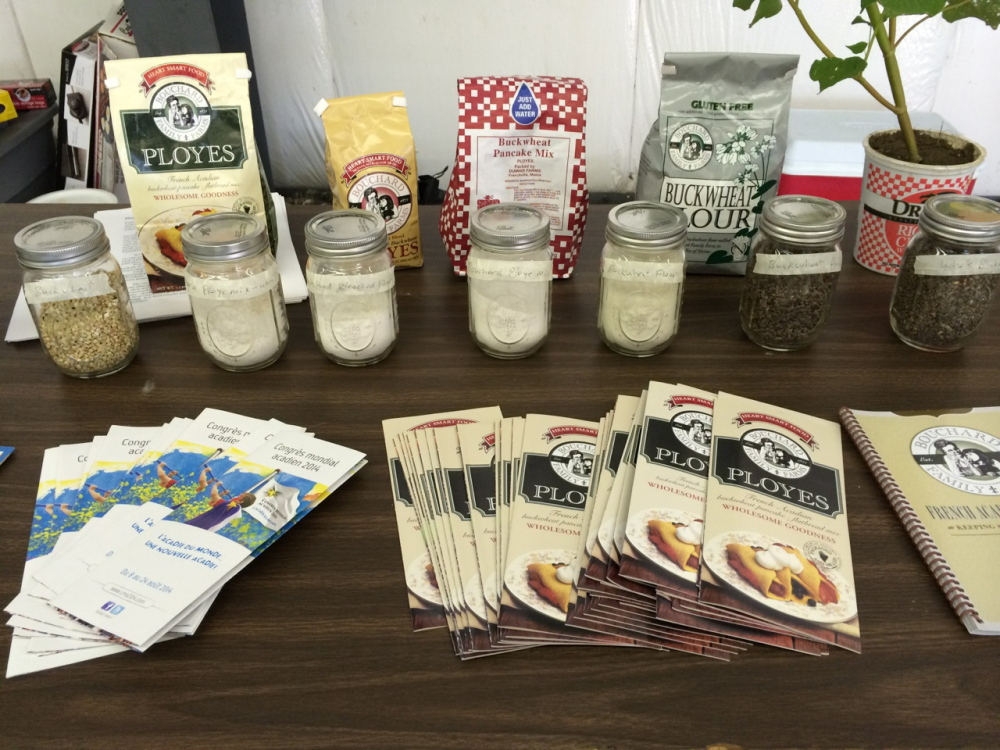 Mixes, ingredients and pamphlets populate a display about making ployes at the Kneading Conference in Skowhegan.