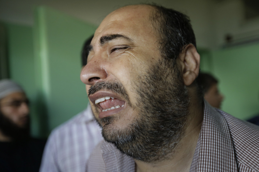 A Palestinian relative of a person who was wounded in an Israeli strike in Jebaliya refugee camp in the northern Gaza Strip cries as he exits the emergency room at the Kamal Adwan hospital in Beit Lahiya on Tuesday. Israeli Prime Minister Benjamin Netanyahu said Monday that Israel must be ready for a “prolonged” military operation in the Gaza Strip.