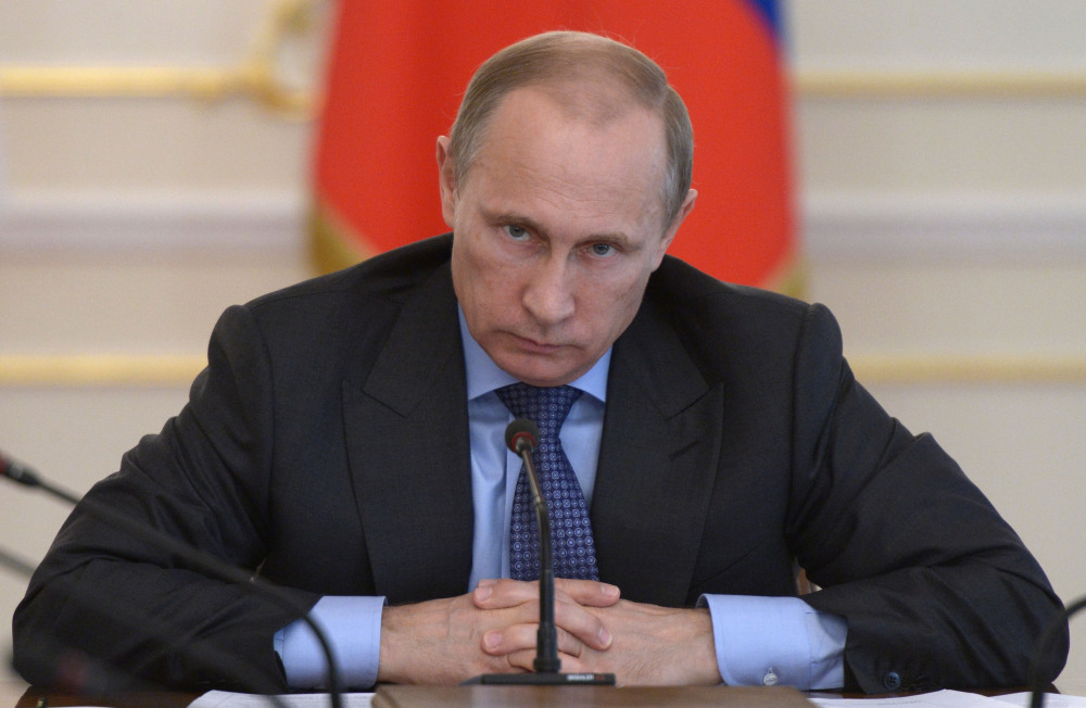 Russian President Vladimir Putin leads a Cabinet meeting Wednesday where officials discussed measures to encourage Russian companies to pull back their offshore assets.