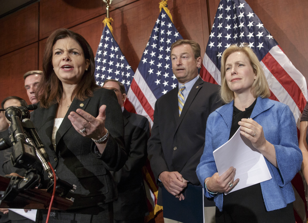 From left, Sen. Kelly Ayotte, R-N.H., Sen. Dean Heller, R-Nev., and Sen. Kirsten Gillibrand, D-N.Y., appear at a news conference on Capitol Hill in Washington on Wednesday.