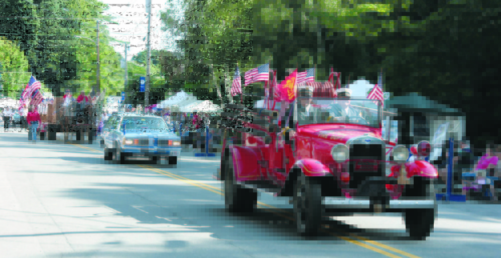 Fire officials lead the parade at a Wilton Blueberry Festival. The annual event started with a Blueberry Church Bazaar and grew into the two-day festival with thousands of attendees.