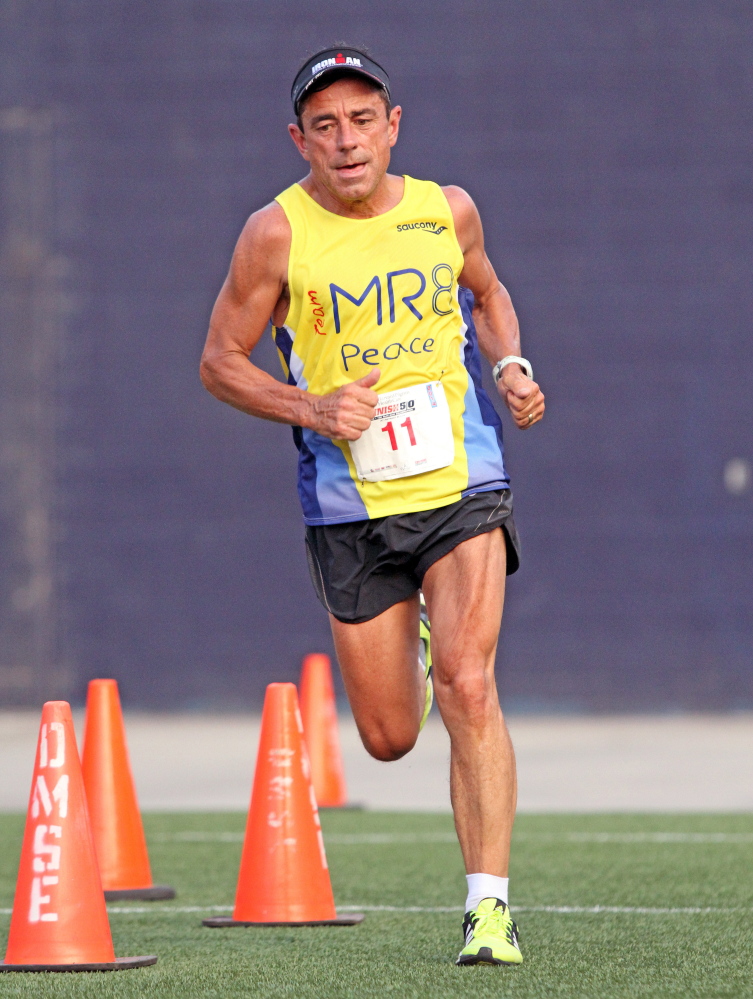 Dave McGillivray runs the Harvard Pilgrim Finish At The 50 10K last July at Gillette Stadium in Foxborough, Mass. A few months later he was shocked to learn he had coronary heart disease.