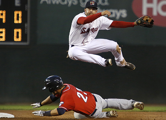 Deven Marrero of Portland leaps over New Hampshire baserunner Kevin Nolan while completing a double-play at Hadlock Field on June 24. Derek Davis/Staff Photographer