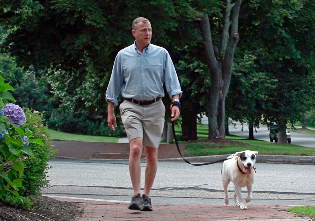 Bill Feldman walks his dog Henry using the hands-free leash wristband he invented.
Photos by Amelia Kunhardt/Staff Photographer