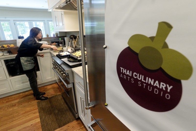 Watcharee Limanon prepares Thai dishes at the Thai Culinary Arts Studio on Cousins Island in Yarmouth.