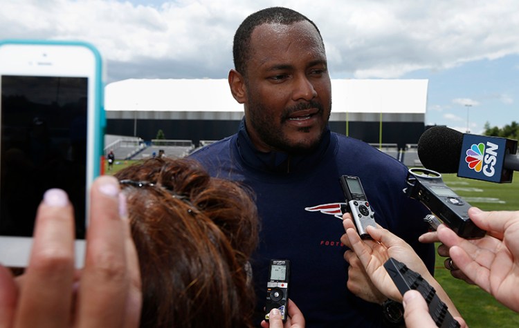 New England Patriots linebacker Will Smith talks with reporters following NFL football mini-camp in Foxborough, Mass., Wednesday. The Associated Press