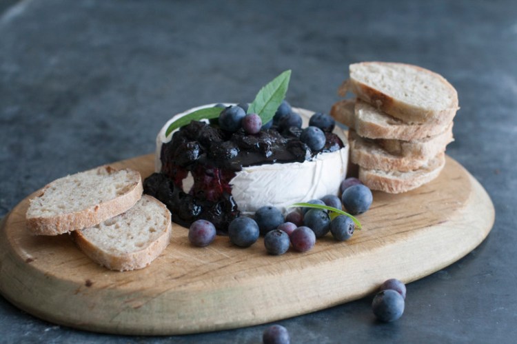 Blueberry topping over brie cheese.