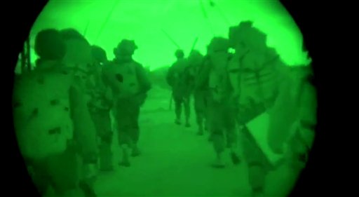 This image made from video shot through a night vision scope shows troops on the move during the early hours of a ground offensive in the Gaza Strip. The Associated Press / Israeli Defense Forces