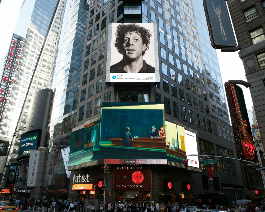 This artist's rendering provided by Art Everywhere U shows, a display in New York's Times Square featuring Chuck Close's "Phil," top, and Edward Hopper's "Nighthawks." Images of famous American artworks will appear on billboards, bus stops, digital display boards and subway platforms Aug. 4 through Aug. 31. The Associated Press