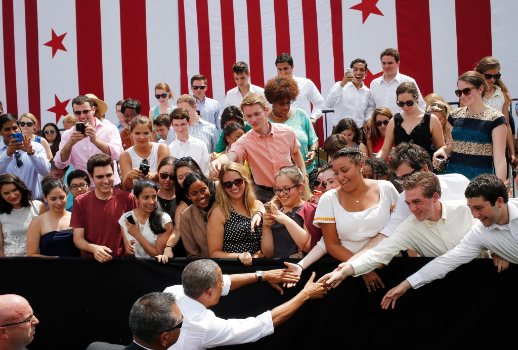 President Barack Obama greets audience members after he spoke about transportation and the economy at Georgetown Waterfront Park in Washington, Tuesday, July 1, 2014. Gridlock in Washington will lead to gridlock across the country if lawmakers cant quickly agree on how to pay for transportation programs, Obama administration officials warn. States will begin to feel the pain of cutbacks within weeks -- peak summer driving time.