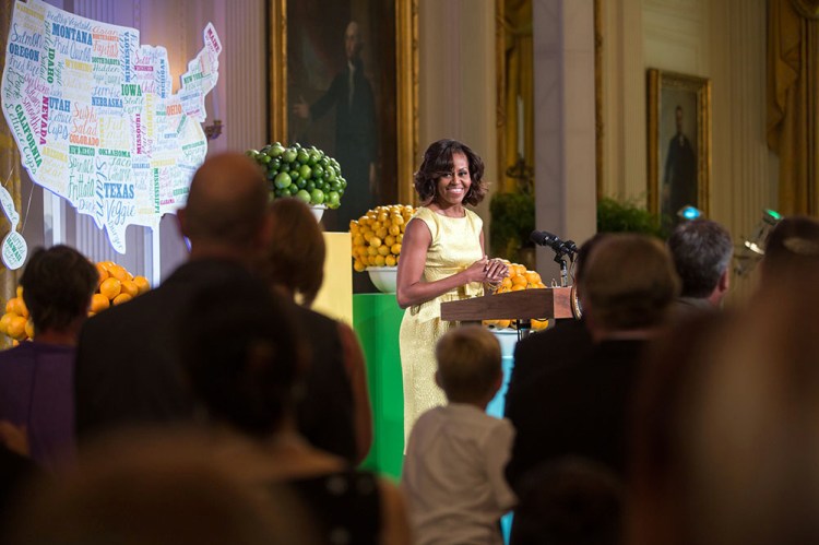 First Lady Michelle Obama delivers remarks and introduces President Barack Obama at the Kids' State Dinner in the East Room of the White House, July 9, 2013.