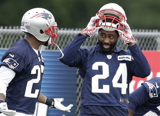 New England Patriots cornerback Darrelle Revis, right, speaks with strong safety Tavon Wilson, left, during practice at Gillette Stadium on Thursday. The Associated Press