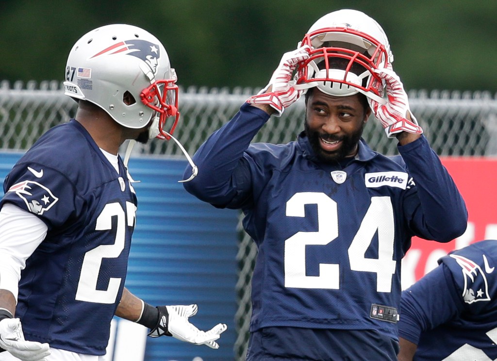Patriots cornerback Darrelle Revis, right, speaks with strong safety Tavon Wilson during a training camp practice at Gillette Stadium on Thursday. The Associated Press