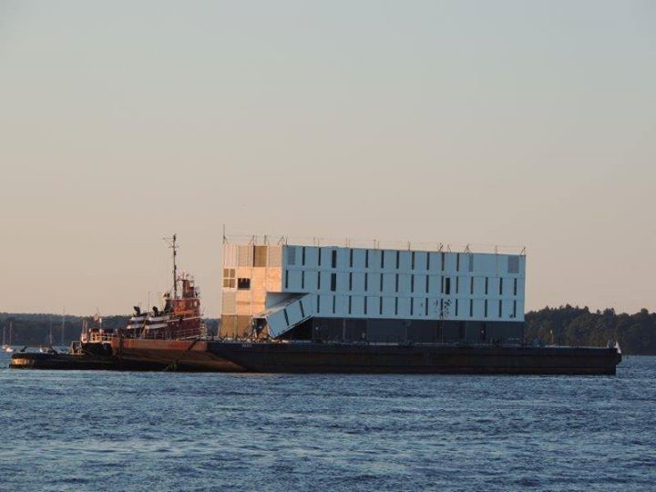 The so-called Google barge, seen leaving Portland Harbor on Monday evening, is "completely hollow inside," said Capt. Brian Fournier, whose Portland Tugboat LLC took the barge to Boston Harbor.