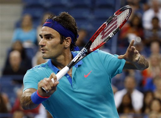 Roger Federer returns to Marcel Granollers in the third round of the 2014 U.S. Open tennis tournament Sunday in New York. The Associated Press