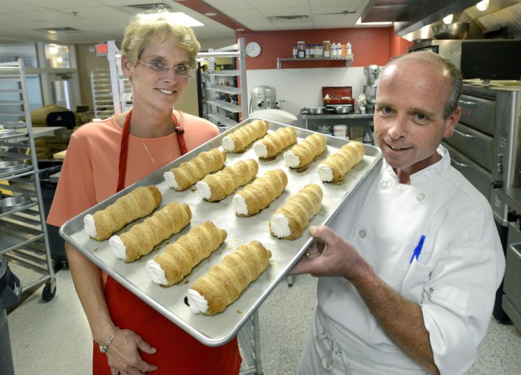 Molly and Ed Foley – and a tray of creme horns. Though they sold the business, the bakery will continue with the Foley name and assurances that the new owner will keep things as is.