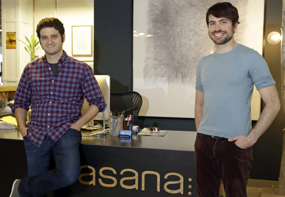 Asana co-founders Dustin Moskovitz, left, and Justin Rosenstein are shown at the company’s headquarters in San Francisco. “We are trying to make all the soul-sucking work that comes with email go away,” Rosenstein says.