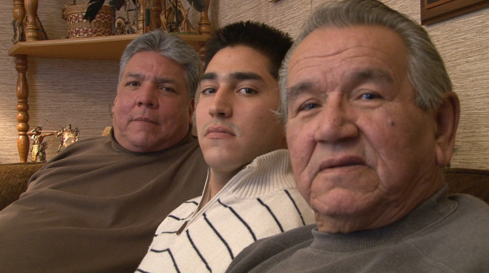 Three generations of the Francis family – from left, Randy Hinton, Michael-Corey Francis Hinton and Peter Francis Jr. – sit for an interview with documentary filmmaker Ben Levine. Levine is producing a film about the crimes against the Francis and Altvater families and the Passamaquoddy people. Photo captured from video by Ben Levine