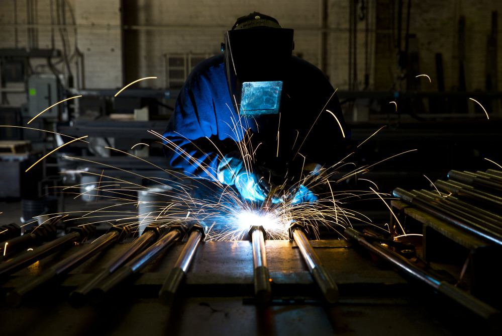 A welder fabricates anchor bolts for roads and bridges at the custom manufacturer Fox Co. Inc. in Philadelphia. Manufacturing added 28,000 jobs in July, the most in eight months. That was just one of the bright spots in a Labor Department report released Friday that showed employers had created 209,000 new jobs last month.