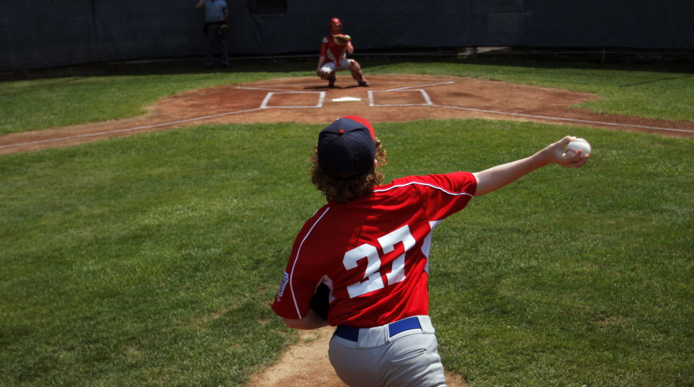 A young player fires a pitch during the opening day of the Little League Baseball state tournament, and you can be sure there were plenty of people keeping track of how many pitches he throws. That’s the new law in Little League, aiming to protect young arms.