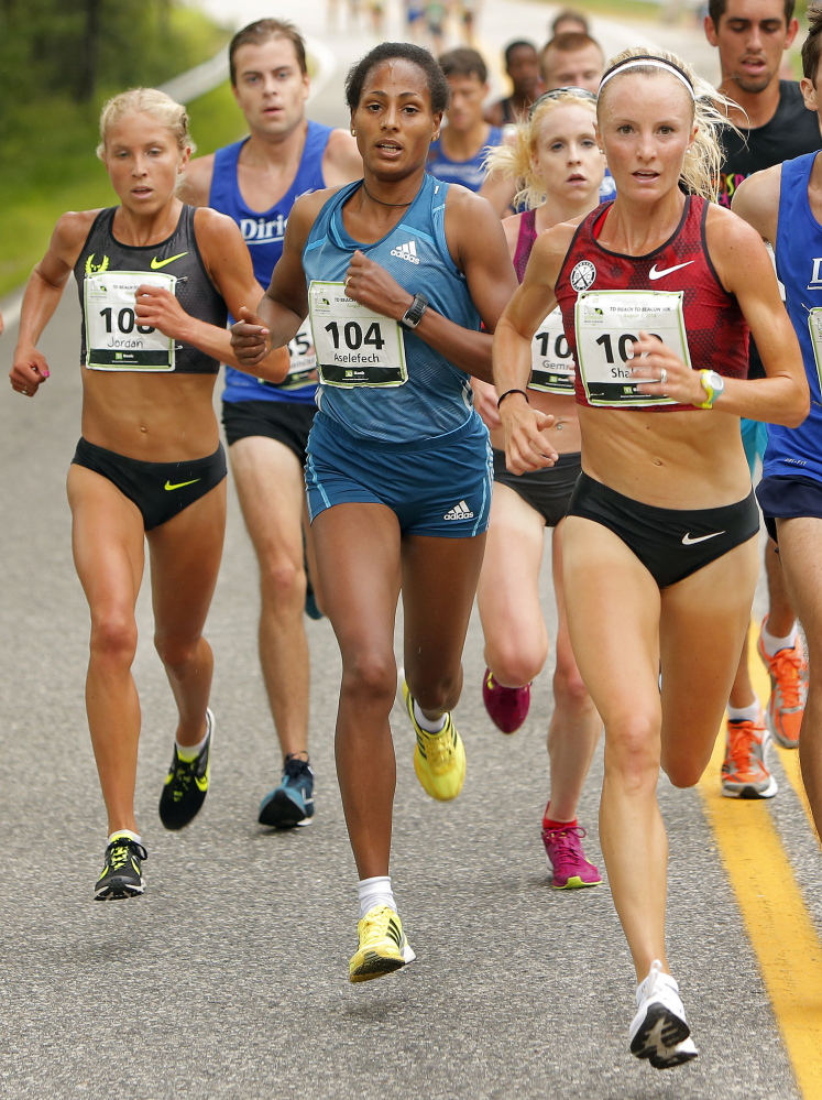 From left, elite women runners Jordan Hasay, (108), Aselefech Mergia (104), Gemma Steel (105) and Shalane Flanagan (102) lead a pack at about the halfway point of the 17th annual TD Beach to Beacon 10K in Cape Elizabeth on Saturday.