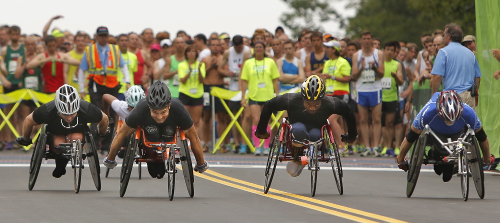 Wheelchair participants pull away from the starting line during the 17th annual TD Beach to Beacon 10K in Cape Elizabeth on Saturday.