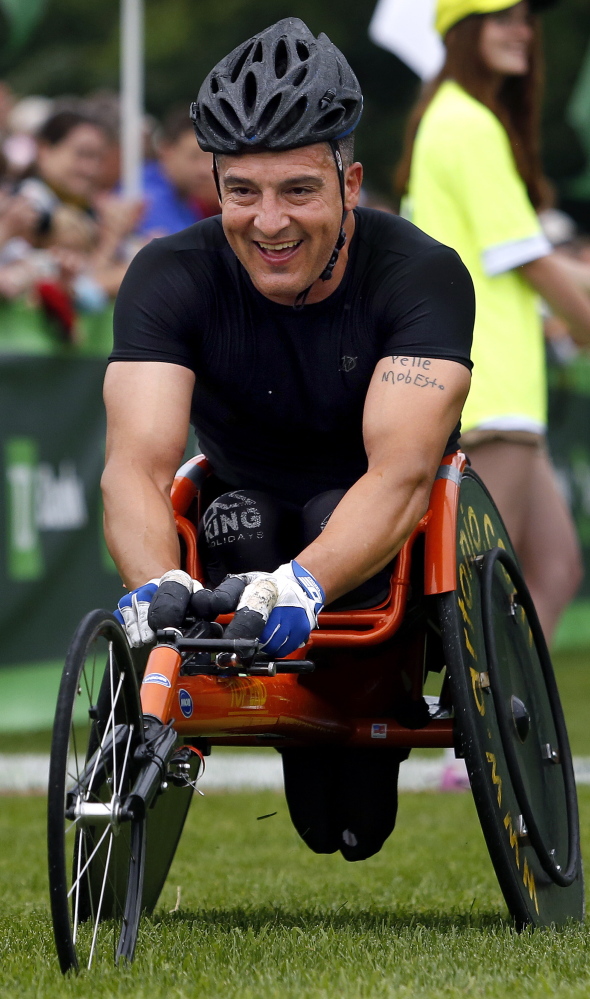 Tony Nogueira of New Jersey finishes first in the men’s wheelchair division at the 17th annual TD Beach to Beacon 10k on Saturday.