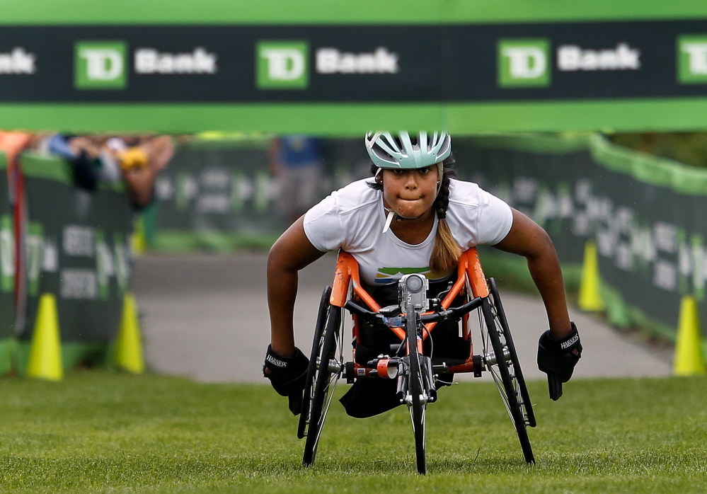 Christina Kouros keeps her eyes on the finish line as she came in first, and was the only entrant, in the female wheelchair division at the 17th annual TD Beach to Beacon 10K on Saturday.
