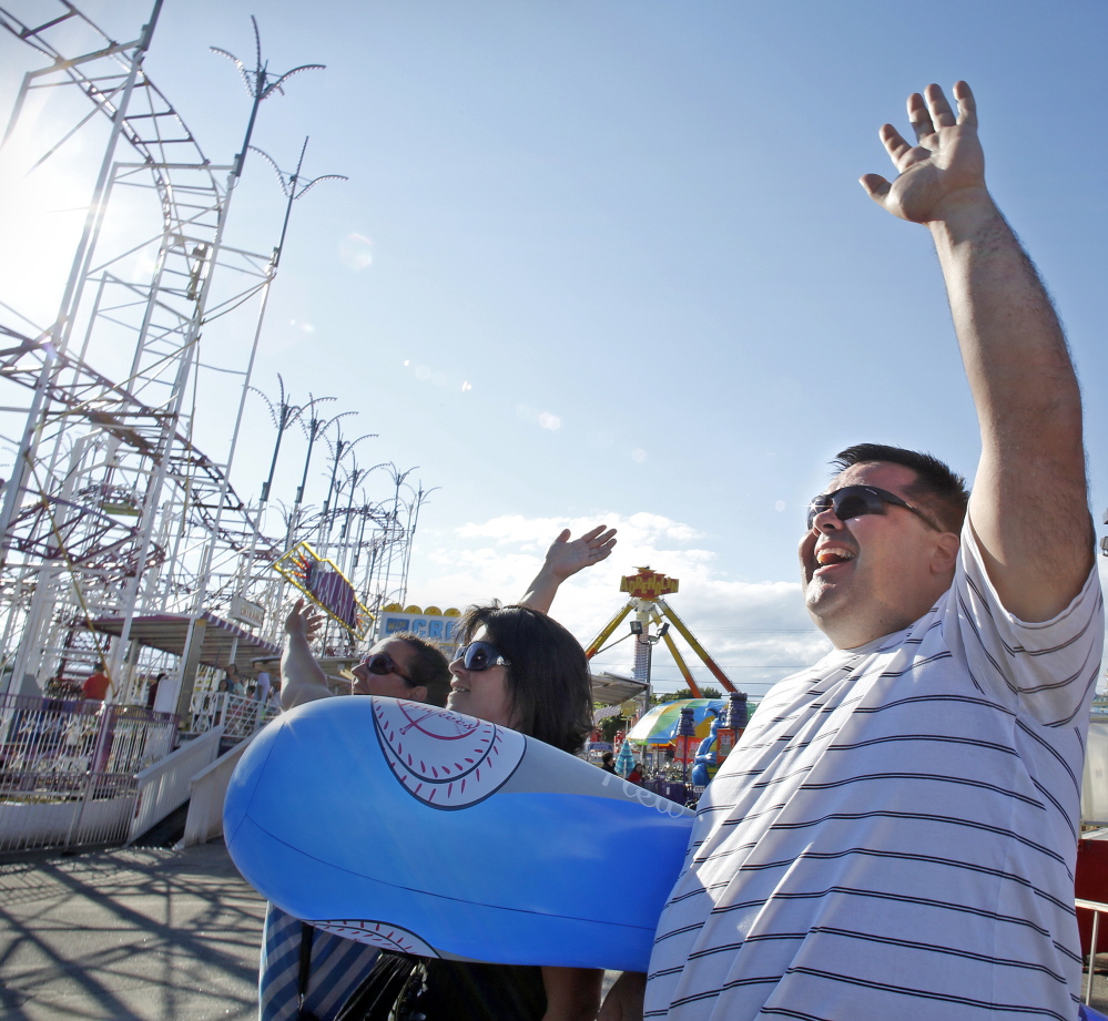Michael Fecteau of Coaticook, Quebec, waves to a family member on a ride at Palace Playland in Old Orchard Beach. He said he’s been visiting the town almost every summer since he was a child.
Amelia Kunhardt/Staff Photographer
