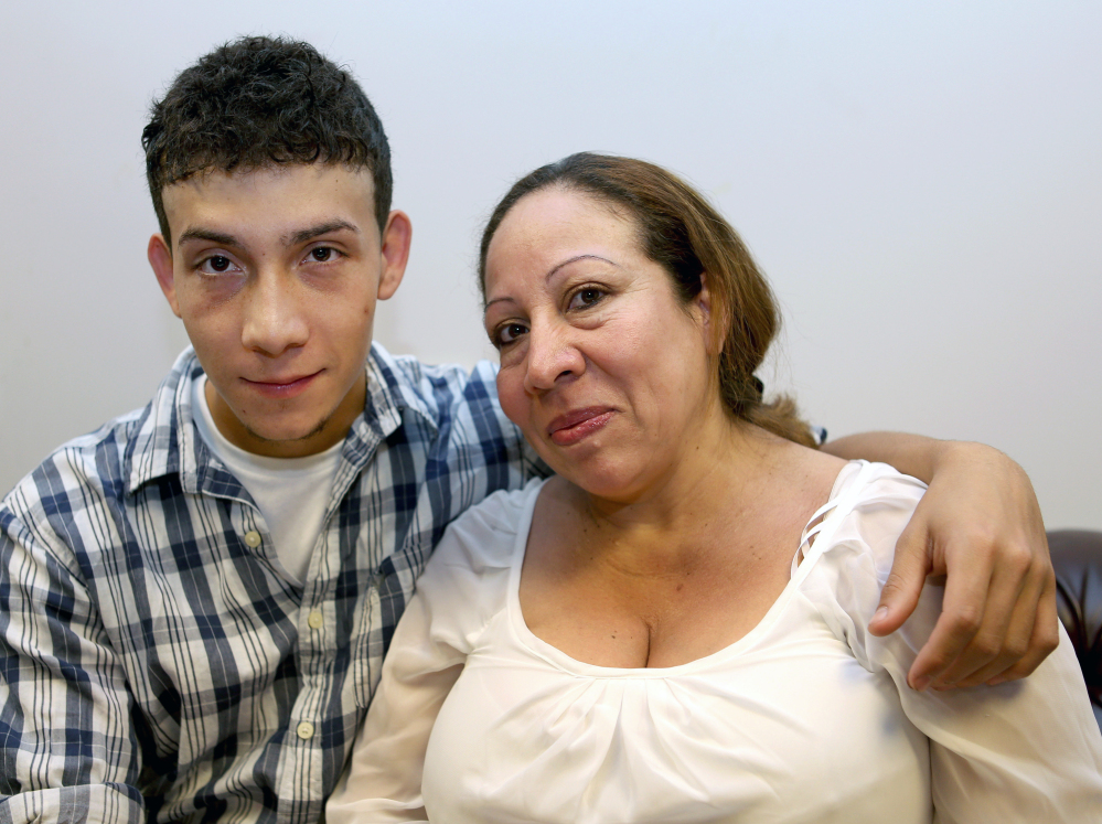 Celvyn Mejia Romero sits with his mother, Susana Romero, before an interview at Greater Boston Legal Services. His tenacious – and unusually long – bid for asylum offers a singular glimpse into the complex world of immigration law and rules.