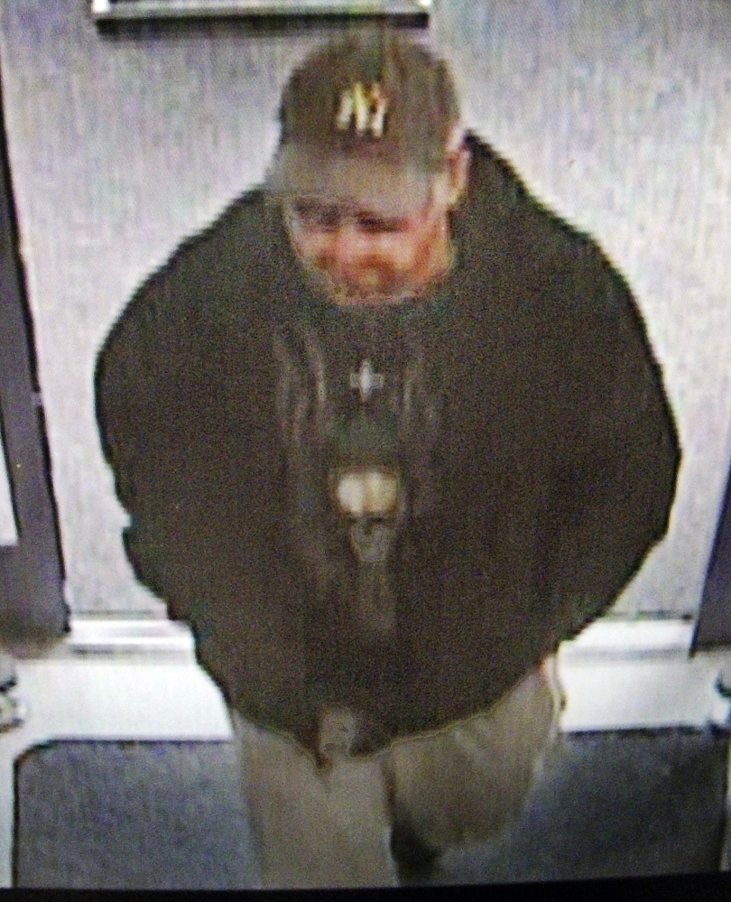 A surveillance photo shows a suspect in the robbery of the Rite Aid pharmacy in Manchester on Sunday.
