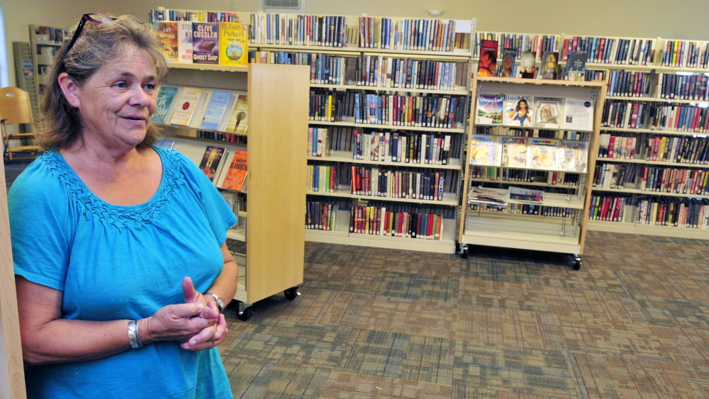 Librarian Donna McClusky is shown in Umberhine Public Library  in Richmond.