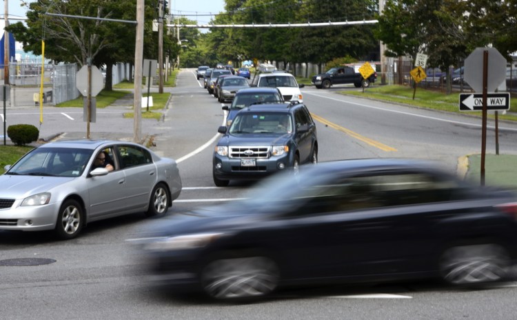 Vehicles back up on Warren Avenue as drivers try to merge into traffic on Cumberland Street in Westbrook during the afternoon commute Friday. There were 79 crashes from 2011 to 2013 at the intersection, the highest crash rate in Cumberland County.