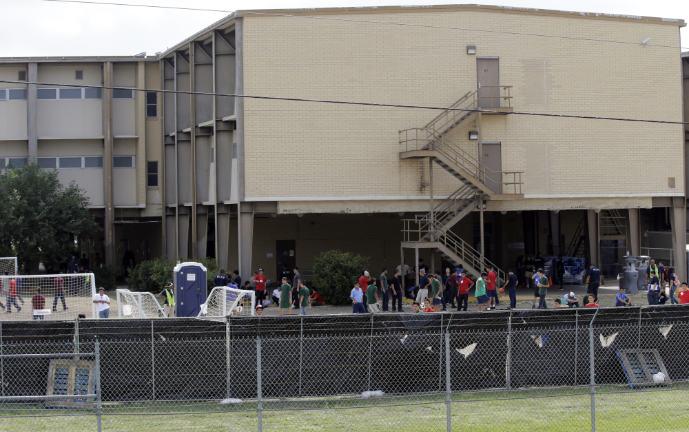 This file photo, taken June 23, shows a shelter at Lackland Air Force Base in San Antonio for unaccompanied minors who enter this country illegally. The government said Monday that it will soon close three shelters it established at military bases to house children caught crossing the border alone.
