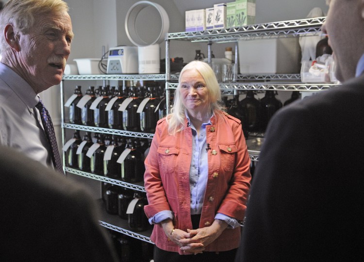 Maine Medicinals CEO Edie Johnston speaks Monday with Sen. Angus King, left, and U.S. Small Business Administration Regional Administrator Seth Goodall in Dresden.