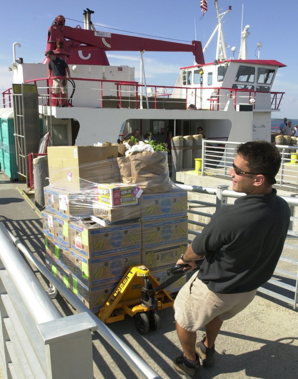 Groceries are unloaded from a Casco Bay Lines ferry onto Long Island. Unrefrigerated food shipments and other cargo are usually the last to come off the island ferries.