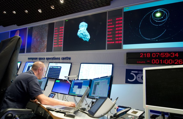 An expert watches his screens at the control center of the European Space Agency, ESA, in Darmstadt, Germany, Wednesday.