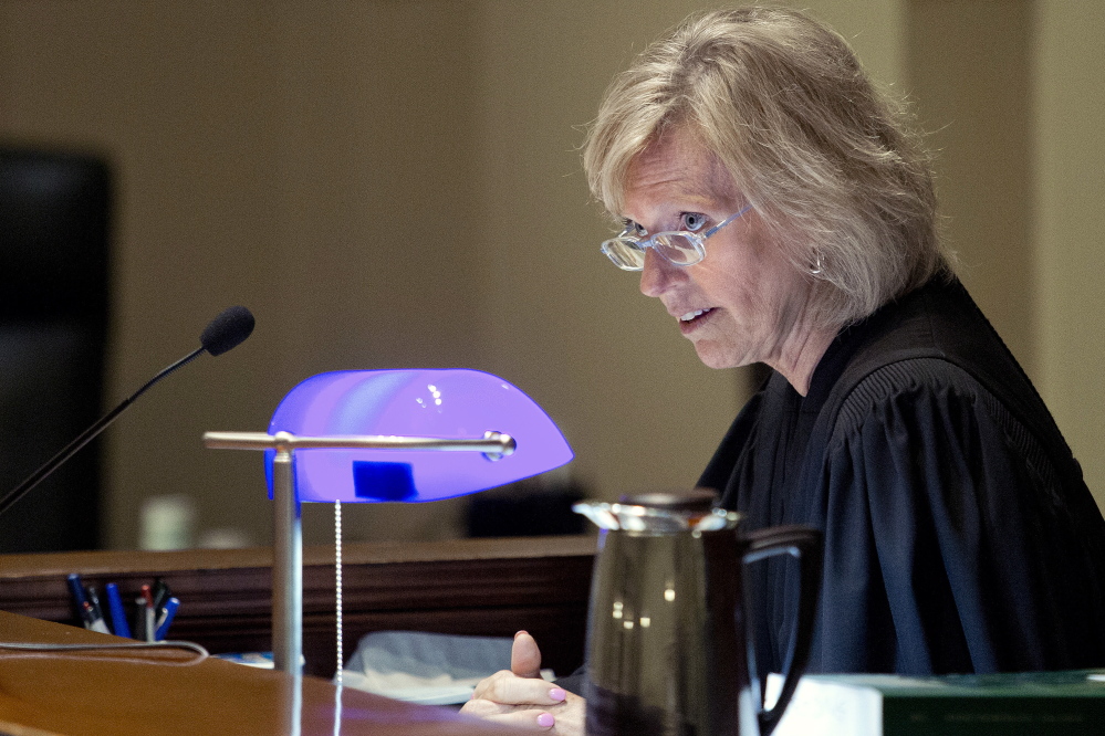 Justice MaryGay Kennedy speaks to defendant Brian Morin, 31, of Lewiston while sentencing him in Androscoggin County Superior Court in Auburn Wednesday to five years in prison followed by 12 years of probation on three counts of felony arson for fires that burned vacant buildings in downtown Lewiston in spring 2013. Gabe Souza/Staff Photographer