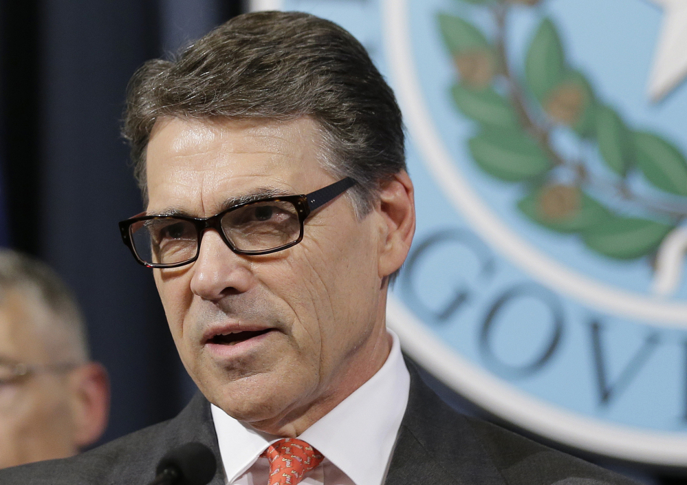 Texas Gov. Rick Perry, seen speaking in Austin, Texas, on July 21, plans to visit New Hampshire this month in an effort to re-engage with voters in the state with the nation’s first presidential primary.