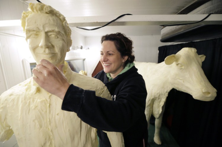 Sarah Pratt works on a butter sculpture of actor Kevin Costner on Wednesday on the eve of opening day of the Iowa State Fair in Des Moines. The "Field of Dreams" movie, which starred Costner and is celebrating it’s 25th anniversary this year, was filmed in Iowa. The 11-day fair runs through Aug. 17.