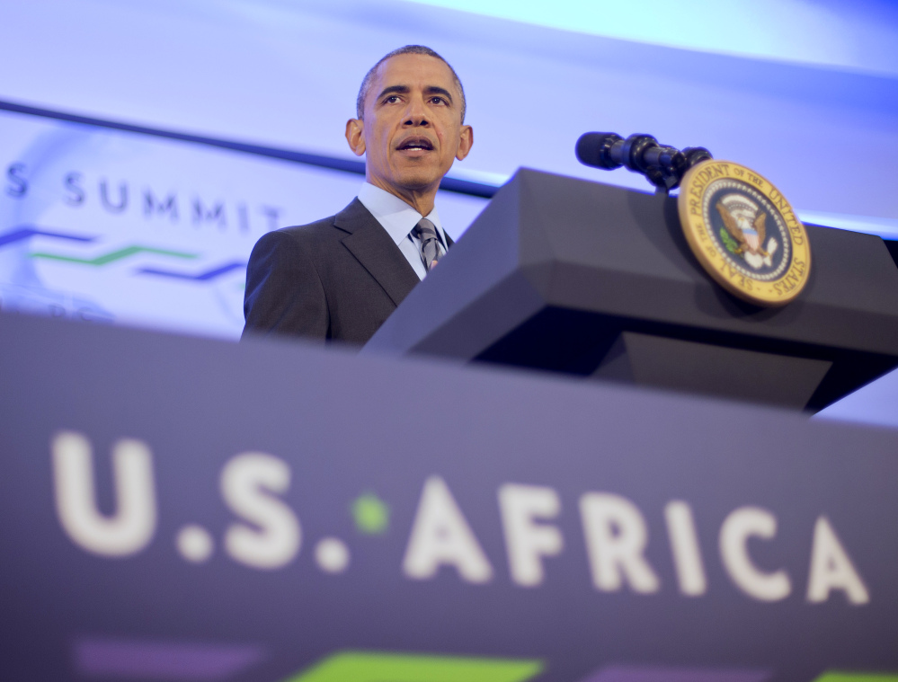 President Obama listens to a question during his news conference Wednesday at the US African Leaders Summit in Washington. Obama and dozens of African leaders opened talks on two issues that threaten to disrupt economic progress on the continent: security and government corruption.