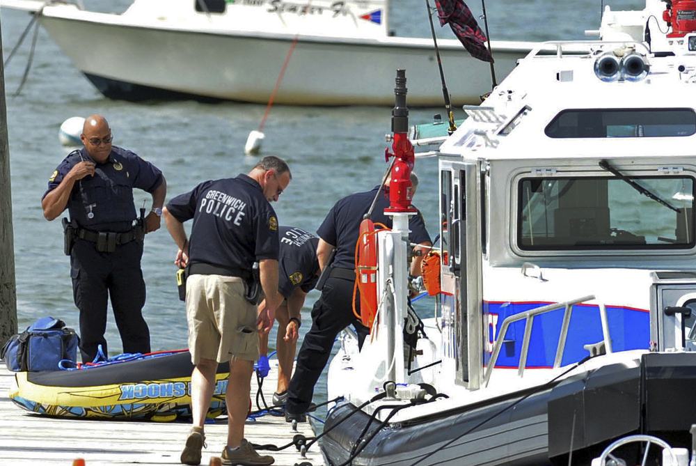 Police work at the scene of a boating accident near Old Greenwich Yacht Club at Greenwich Point, Conn., on Wednesday afternoon. The harbormaster said one girl was killed and another was seriously injured.