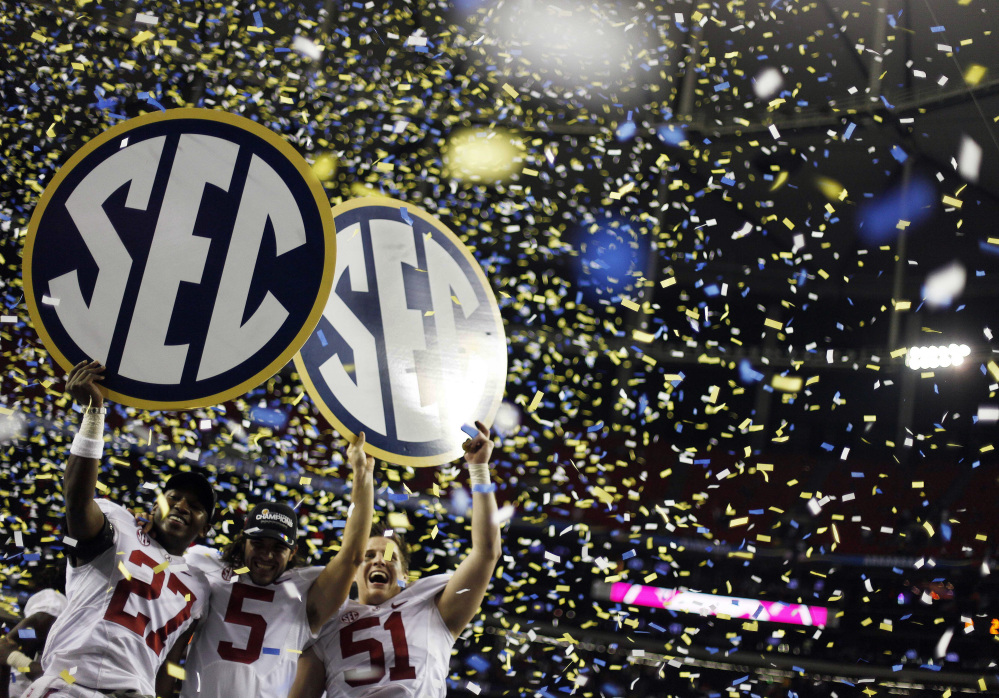 Alabama players celebrate their win in the Southeastern Conference championship NCAA college football game against Georgia, in Atlanta in 2012.