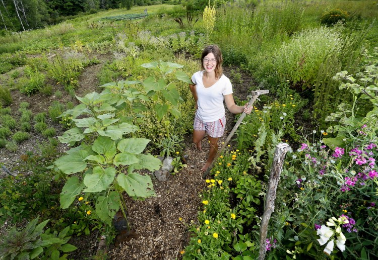 Cassandra Sears in the herb garden at Winslow Farm in West Falmouth.