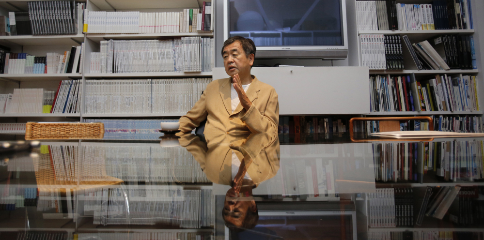 Japan's Kengo Kuma discusses architecture at his office in Tokyo. A new generation of japanese architects believes the world has fallen out of love with steel and concrete skyscrapers, so they are designing human-friendly alternatives that some say have roots in the elegant simplicity of the traditional Japanese tea house.