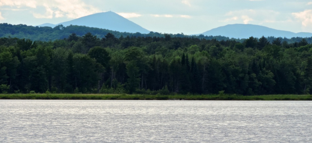 Sugarloaf Mountain’s classical pyramidal peak is especially impressive when viewed from a canoe on Wesserunsett Lake in picturesque Somerset County.
