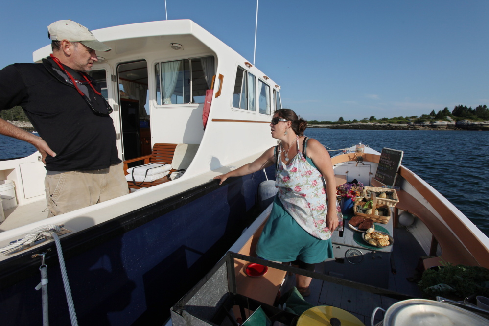 Reilly Harvey is back in business selling lobster dinners and baked goods to boaters in Penobscot Bay. Joel Page/Staff Photographer