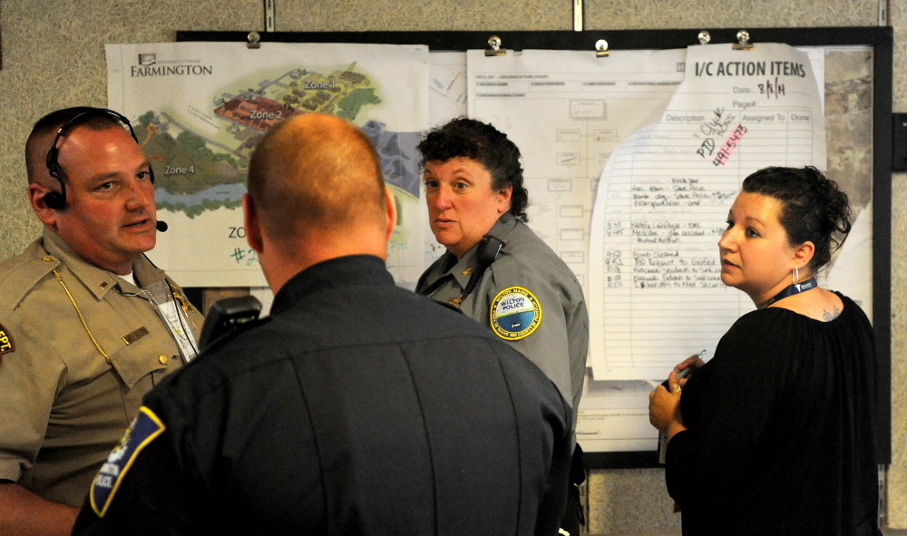 Wilton Police Chief Heidi Wilcox, facing center, acts as the incident commander from the Farmington Fire Department during a Homeland Security drill in Farmington on Friday.