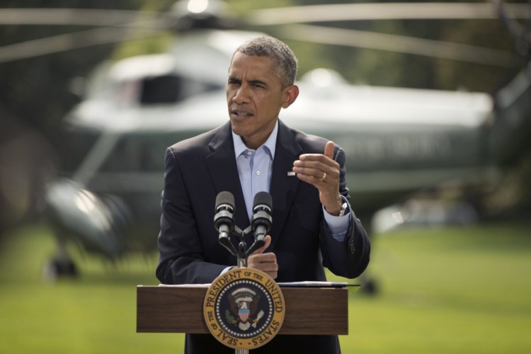 President Barack Obama speaks on the South Lawn of the White House in Washington, Saturday, about ongoing situation in Iraq before his departure on Marine One for a vacation in Martha’s Vineyard.